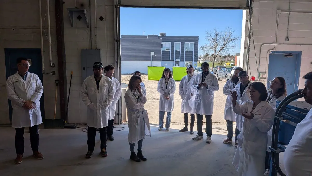 Team in lab coats outside an AGAT laboratory