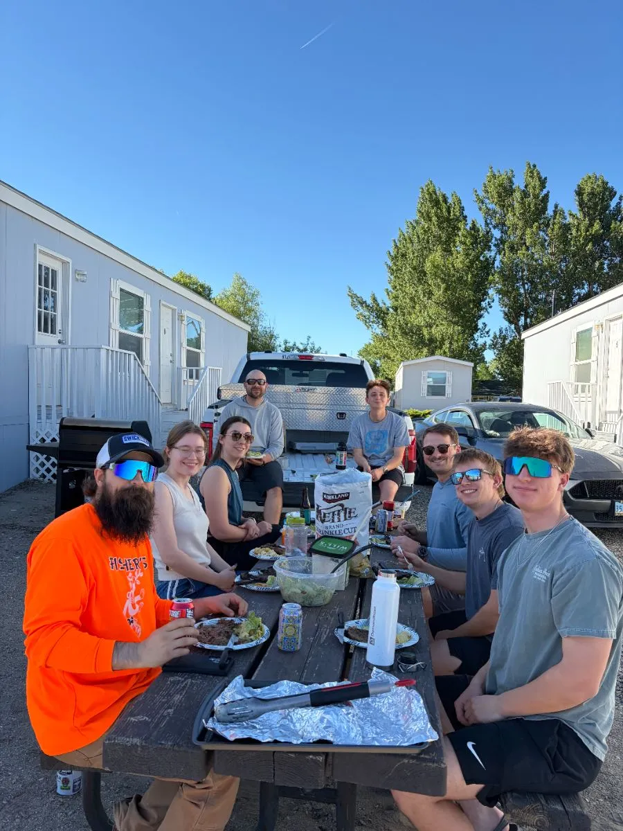 Crew barbecue at a picnic table at Pumpkin Hollow camp