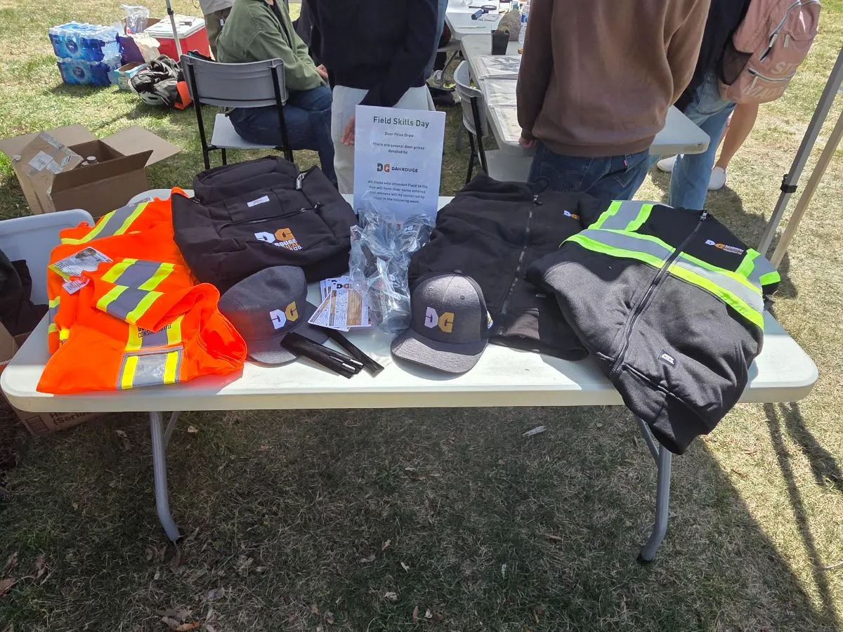 Dahrouge vests, hats and prizes on a table at Field Skills Day